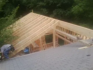 Framing a new roof addition that ties into an existing shingle roof in Trufant